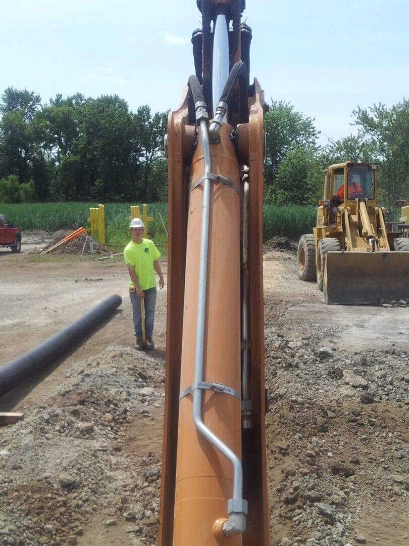 A man standing next to a construction site.