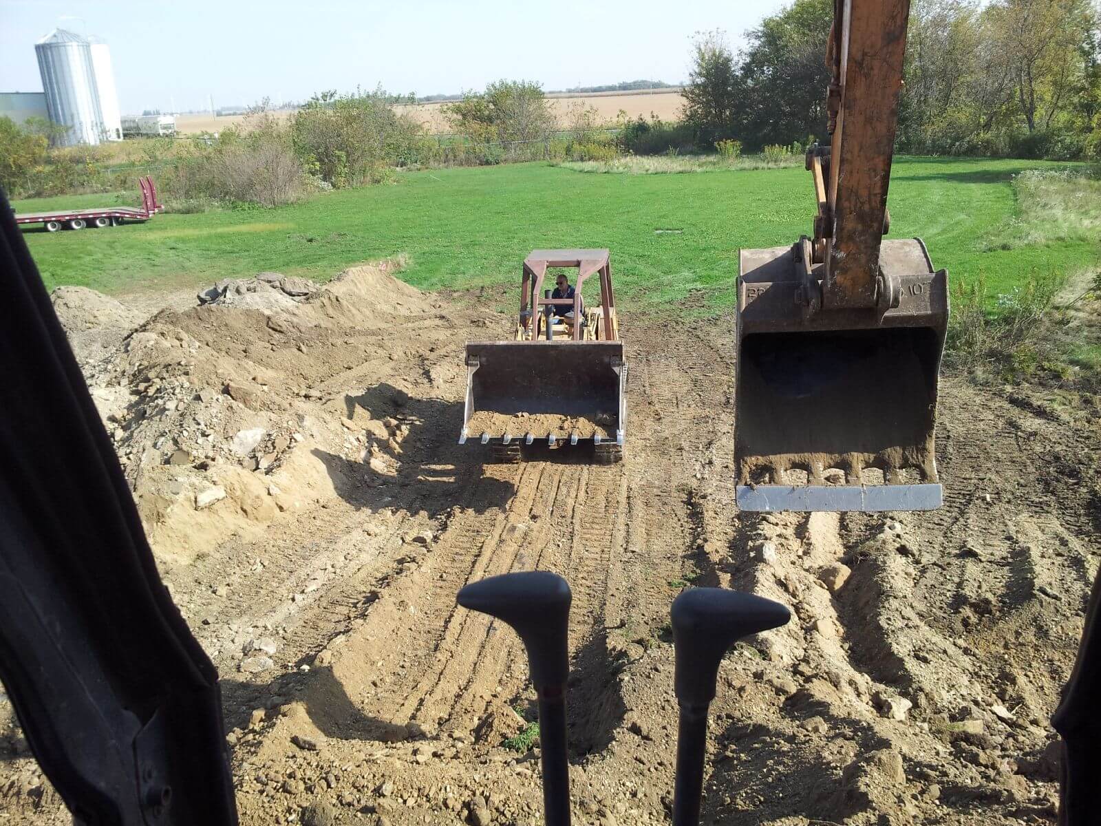 A view of some dirt and grass from the ground.